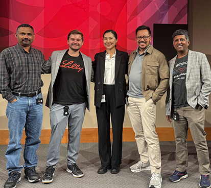 Ardak Baizhaxynova, center, with colleagues from Eli Lilly